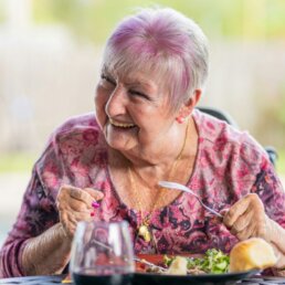 Life at Care Home Macclesfield – A resident staying with us on Residential Care enjoying her meal at Riseley House Residential Care Home in Macclesfield