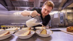 Chef Liam making a wonderfully tasty cake with custard for our care home residents and team at Riseley House Care Home in Macclesfield