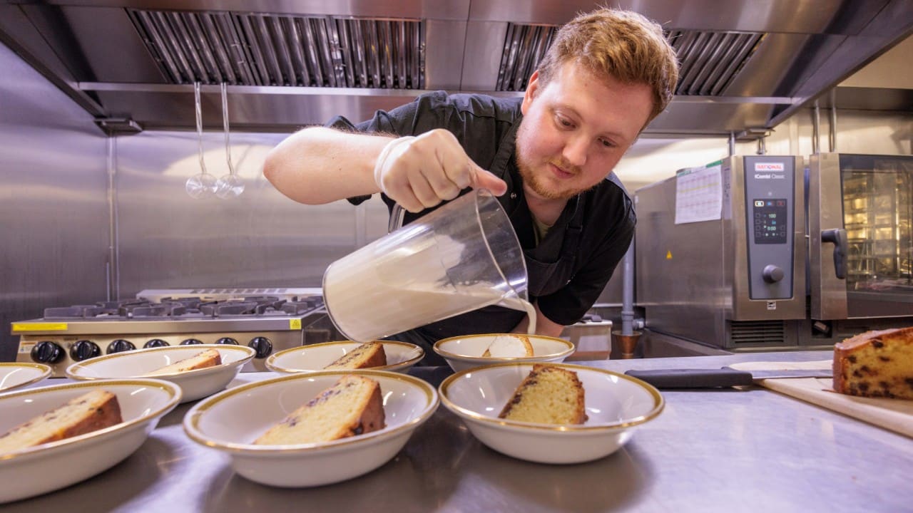 Chef Liam making a wonderfully tasty cake with custard for our care home residents and team at Riseley House Care Home in Macclesfield