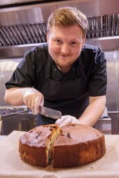 Chef Liam cutting another delicious cake at Riseley House Care Home in Macclesfield